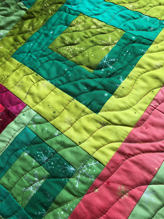 Wavy quilting on a patchwork table runner